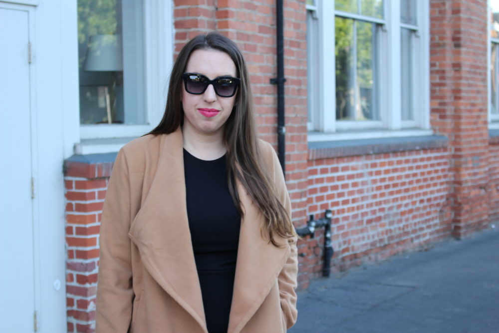 camel coat - black dress - pink lipstick